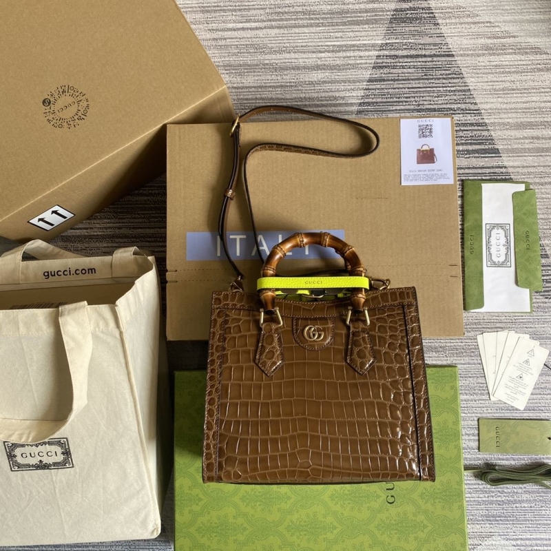 G*u*i top handle bags